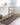 Kimi Becki Owens Modern Solid And Border Fringe Global Grey, Light Brown & Black Rug