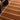 Fable Rust Hand-Tufted Wool Checked Rug - Close Up lifestyle view
