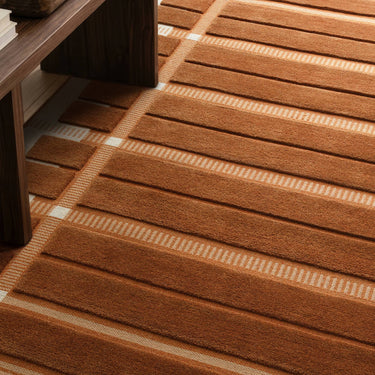 Fable Rust Hand-Tufted Wool Checked Rug - Close Up lifestyle view