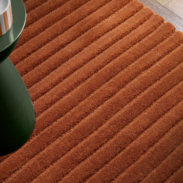 Linie Rust Hand-Woven Wool Ribbed Textured Rug - Close Up lifestyle view