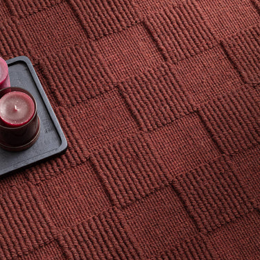 Mercer Burgundy Hand-Woven Wool Checkerboard Rug - Close Up lifestyle view